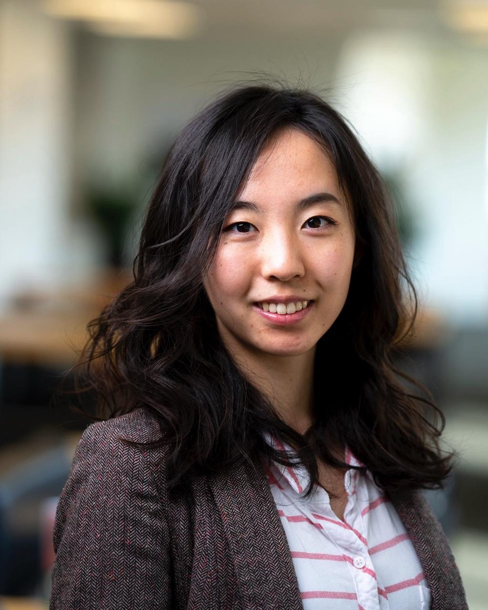 Yifei Sylvia Lin, genetic counselor, smiling in a professional portrait